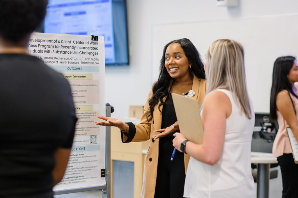 Business student presents at networking event