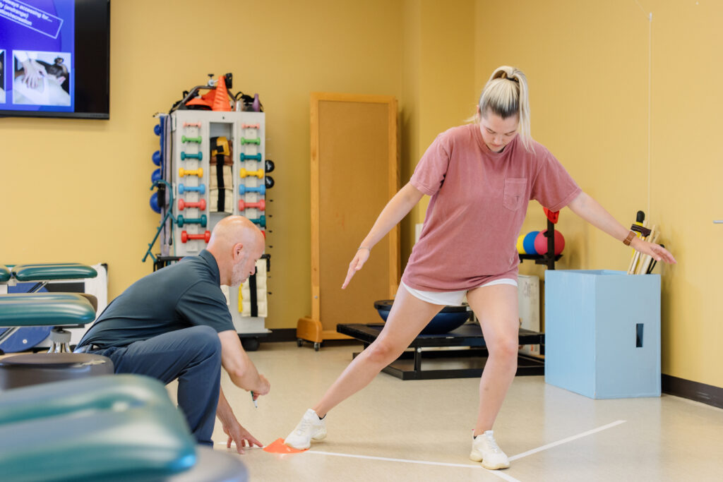 Physical therapy student and professor practice techniques