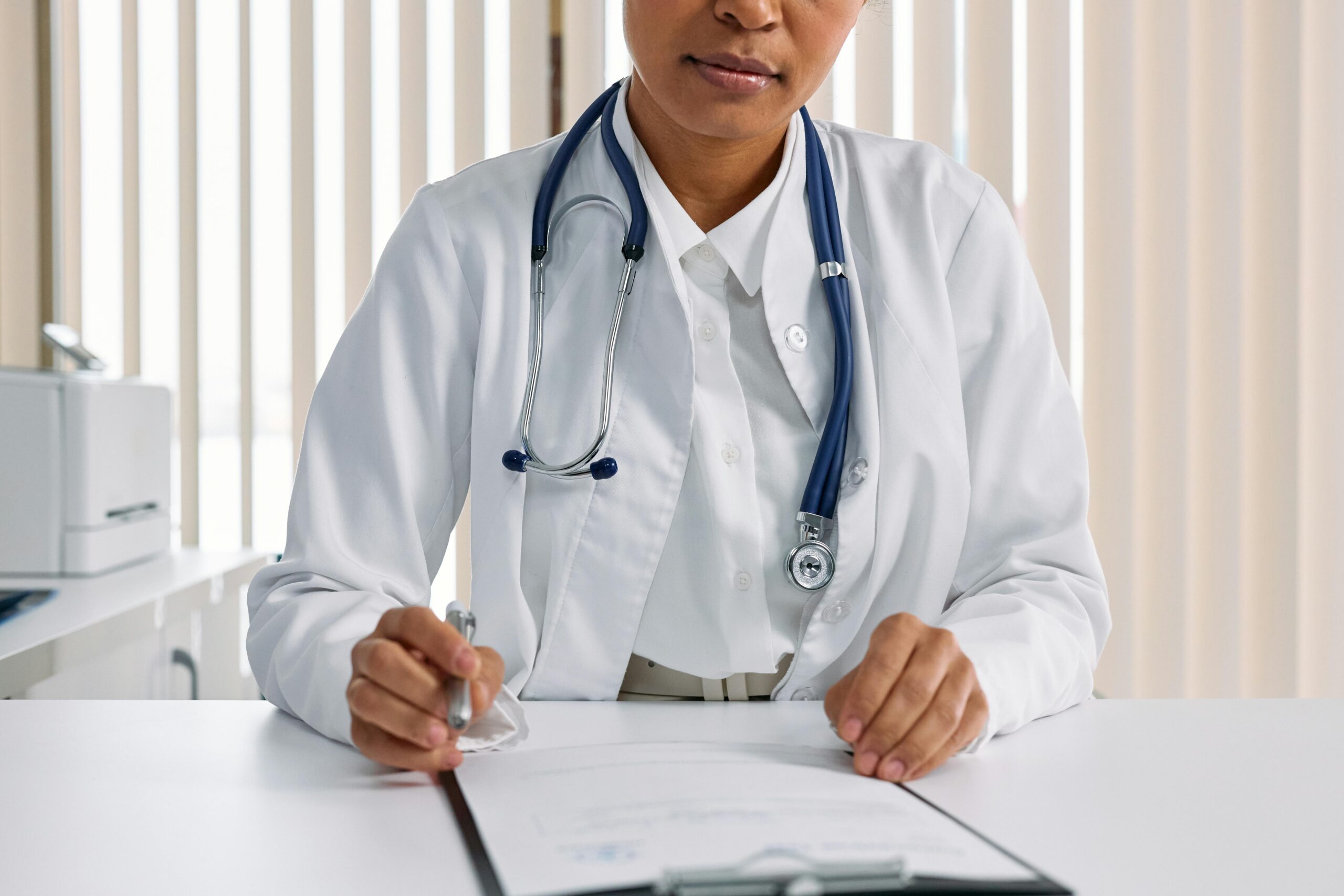 A healthcare administrator reads a medical document