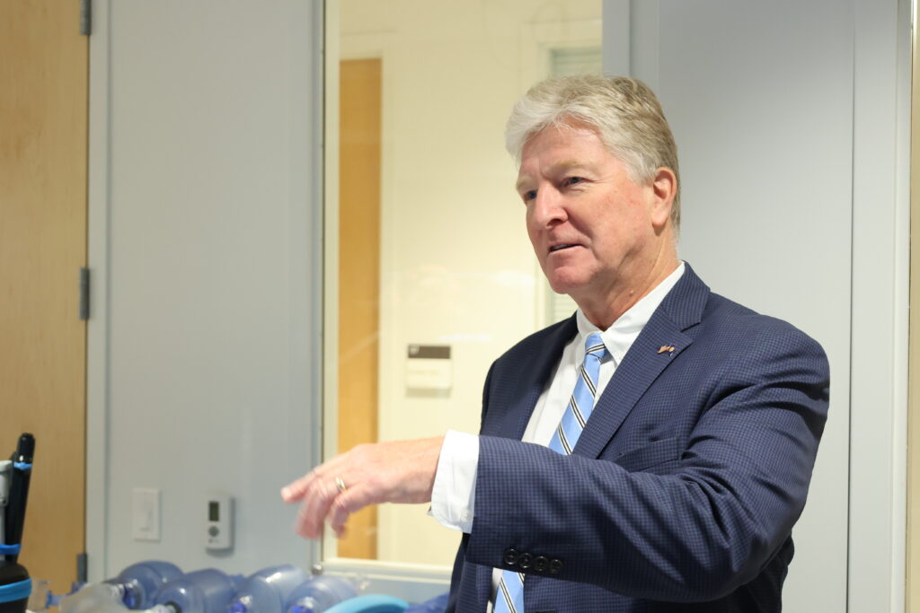 A guest asks a question in the practice operating room