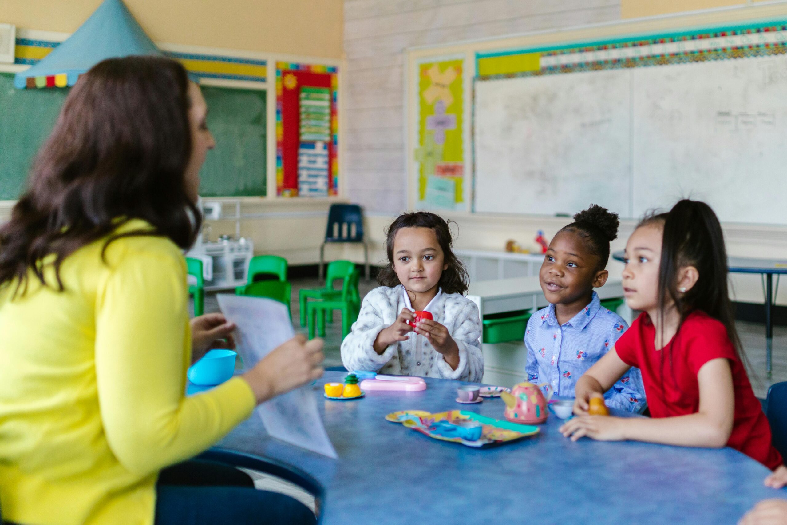 A teacher shares instruction with her students