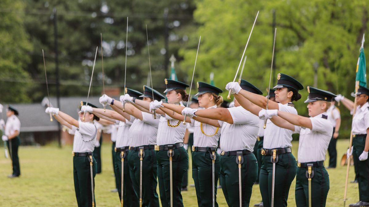 A line of VWIL cadets present their sabers for inspection.