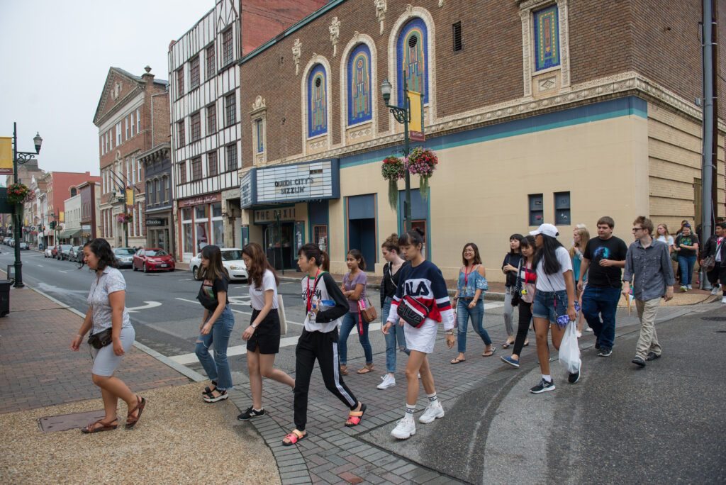 Crowd of students crossing a street in Staunton