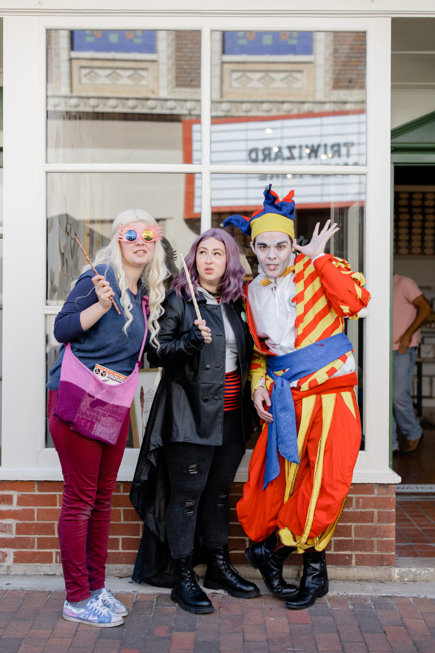 Three people in costumes posing in downtown Staunton