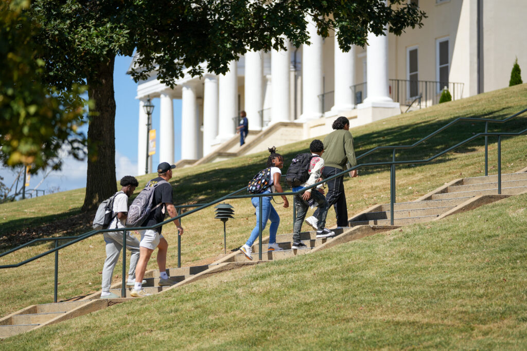 Students walking up steps on campus