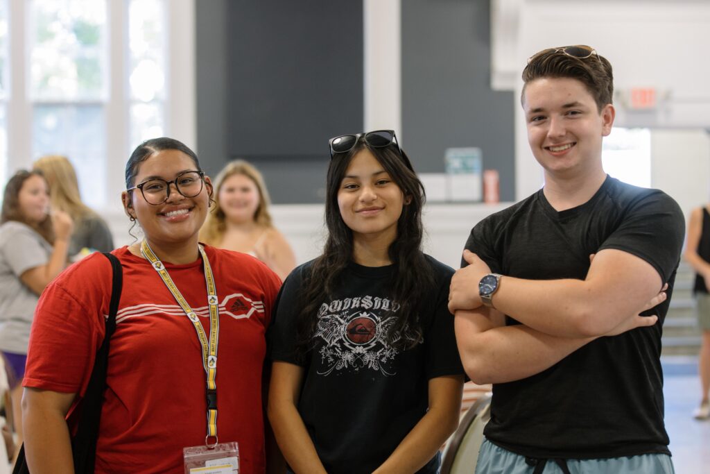 Students pose and smile