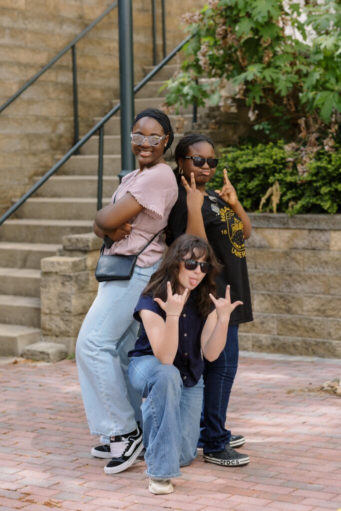 Three PEG students pose for a silly picture.