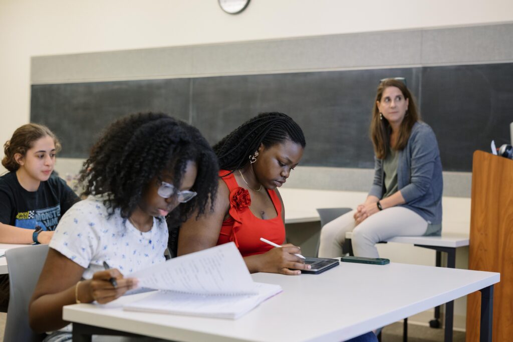 Two PEG students studying in a classroom