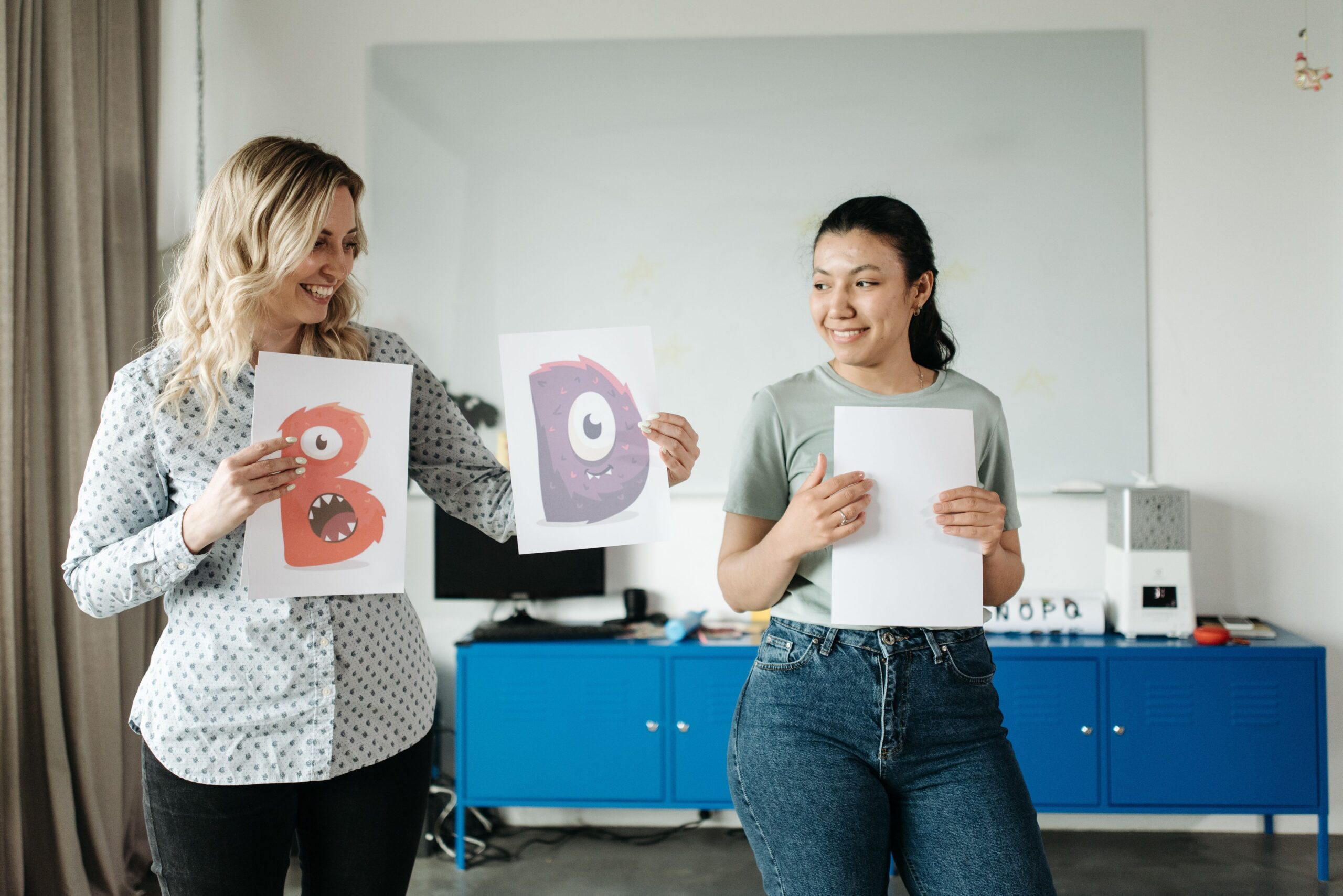 A curriculum designer leads a teacher through her course materials